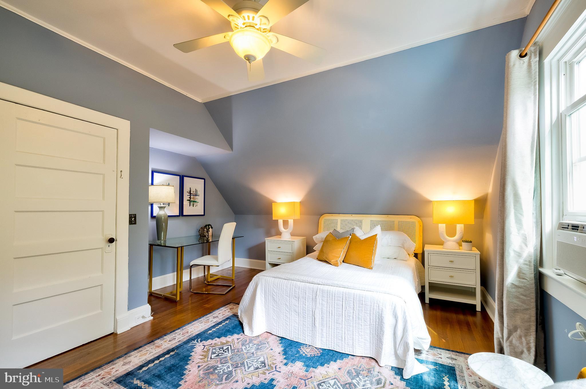 2925 Covington Road Silver Spring, MD 20910 - Photo 41 of 70 a bedroom with a bed and a lamp on dresser