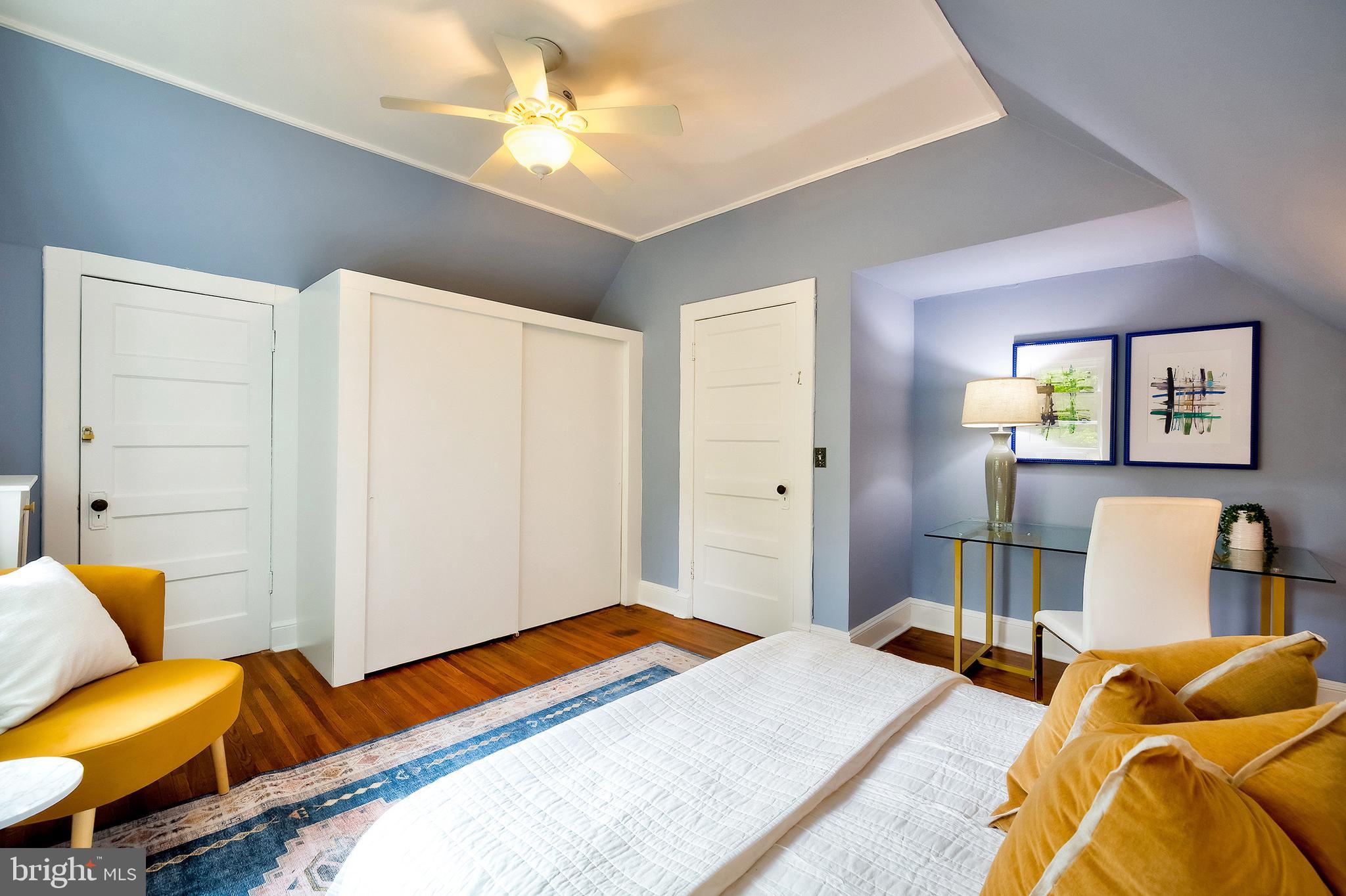 2925 Covington Road Silver Spring, MD 20910 - Photo 42 of 70 a bedroom with a bed and wooden floor