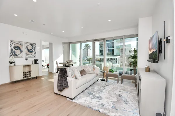 a living room with furniture and a large window