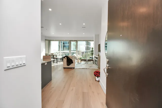 a view of living room with furniture and wooden floor