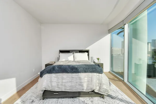 a room with a bed and a night stand