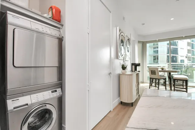 a view of a hallway with washer and dryer