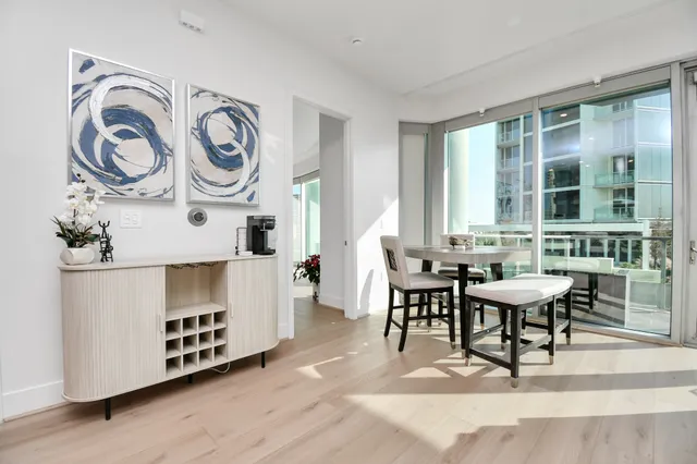 a view of a dining room with furniture window and wooden floor