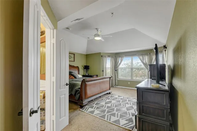 a large en suite bathroom with sink mirror and a bathtub