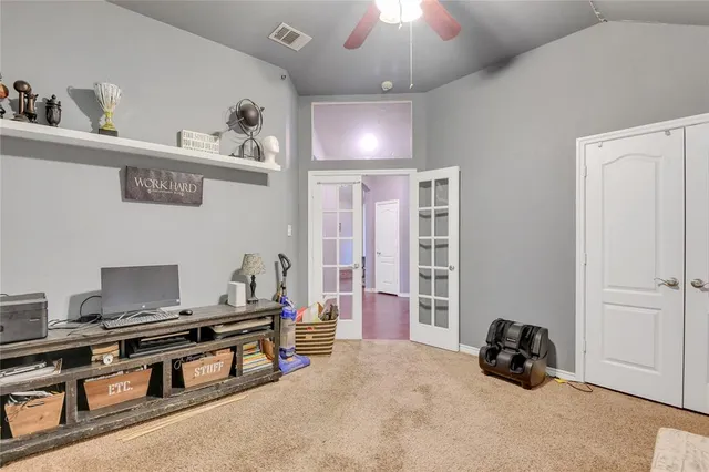 a bedroom with furniture and a chandelier