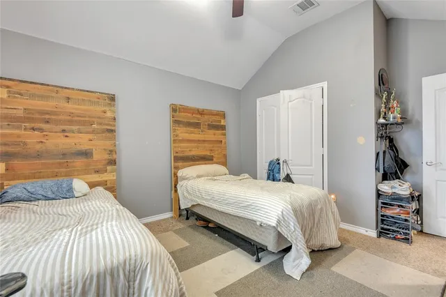 a bedroom with a bed and a cabinets
