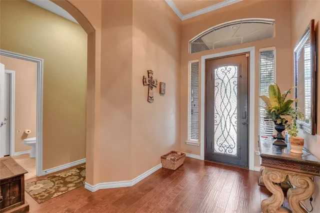 a view of an entryway with wooden floor