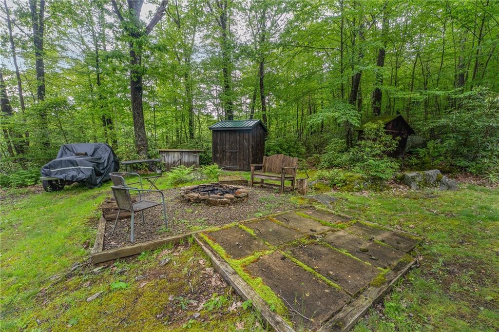 124 New Beaver Creek Road Markleysburg, PA 15459 - Photo 8 of 31 a view of a backyard with sitting area