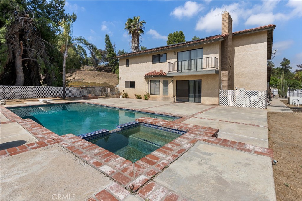 17656 Mockingbird Hill Circle Riverside, CA 92504 - Photo 27 of 49 a view of a house with a swimming pool