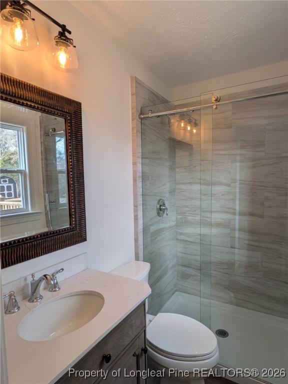 15 Happy Valley Drive Spring Lake, NC 28390 - Photo 4 of 16 a bathroom with a sink a toilet and shower