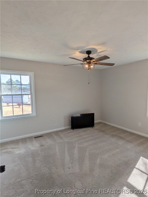 15 Happy Valley Drive Spring Lake, NC 28390 - Photo 6 of 16 an empty room with a ceiling fan and window