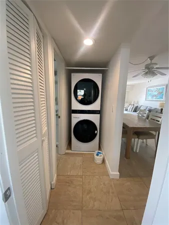 a hallway with washer and dryer