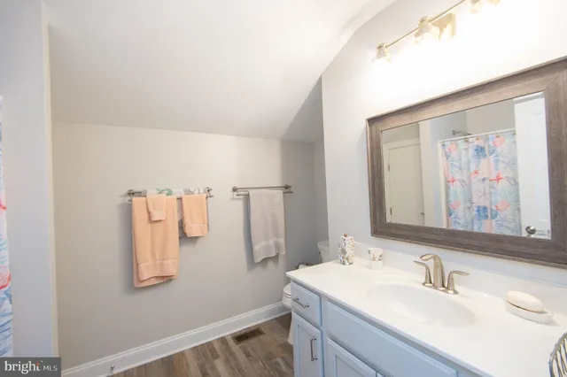 a room with gym equipment and a flat screen tv