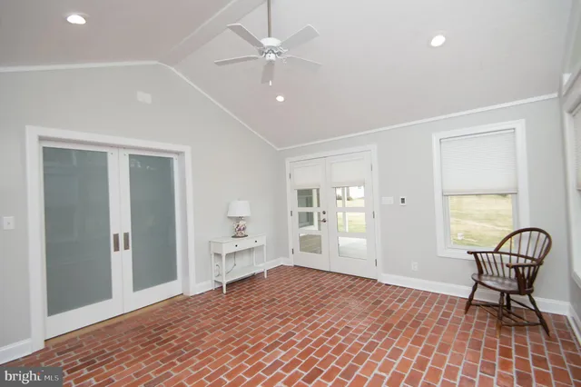 a front view of a house with a yard outdoor seating and garage