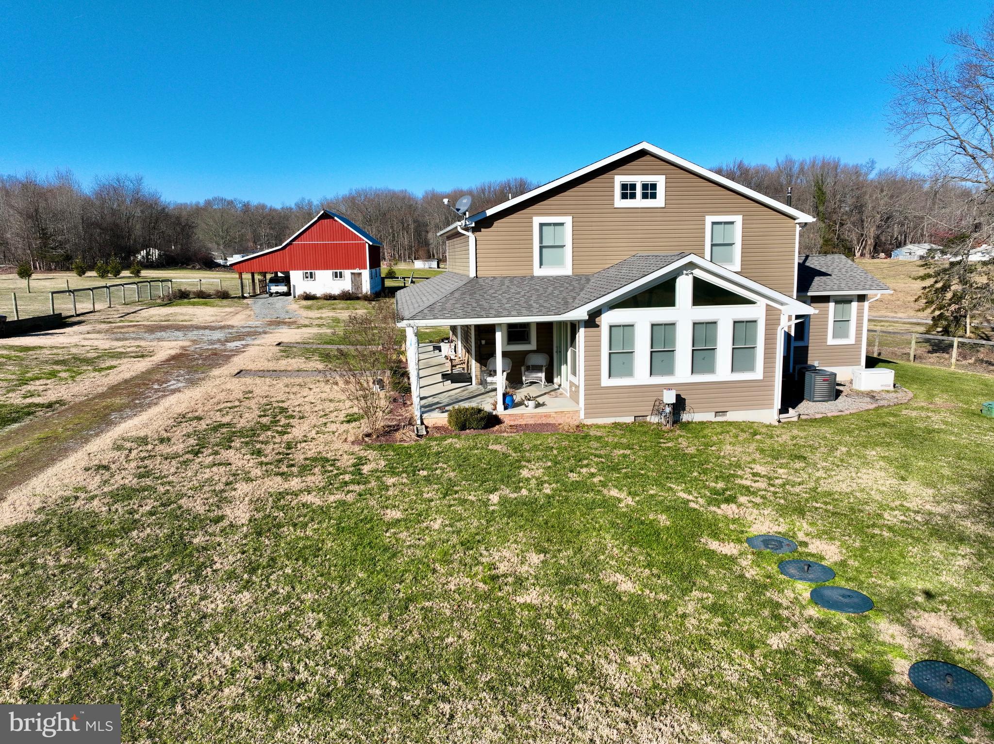 240 Randalia Road Chesapeake City, MD 21915 - Photo 5 of 23 a front view of a house with a yard