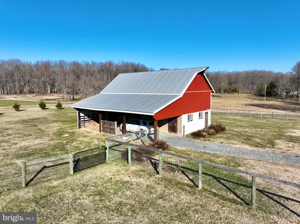 a kitchen with stainless steel appliances a refrigerator and a stove top oven