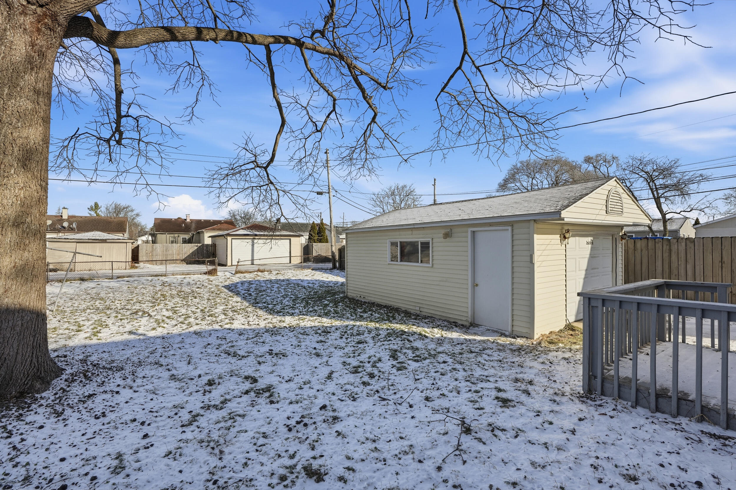 2731 Strong Street Highland, IN 46322 - Photo 16 of 16 a view of a house with a small yard and wooden fence