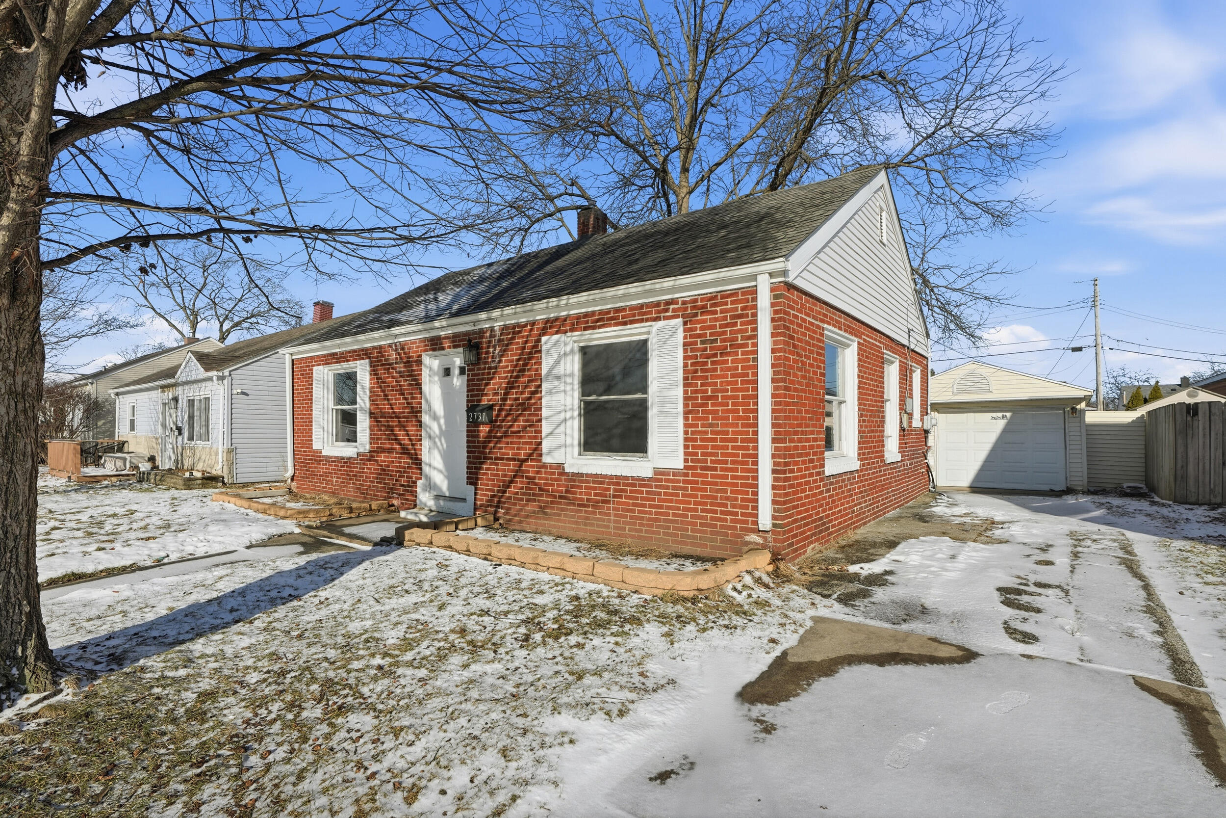 2731 Strong Street Highland, IN 46322 - Photo 2 of 16 a view of a house with snow on the side of the road