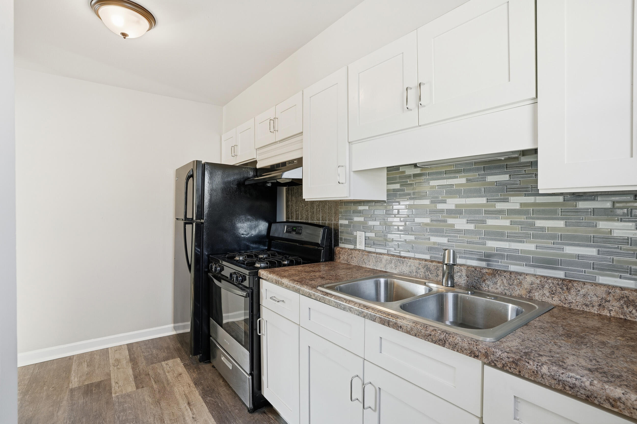 2731 Strong Street Highland, IN 46322 - Photo 8 of 16 a kitchen with a refrigerator sink and cabinets