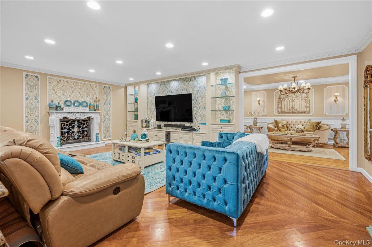 626 Caledonia Road Dix Hills, NY 11746 - Photo 9 of 49 a living room with furniture flat screen tv and a fireplace