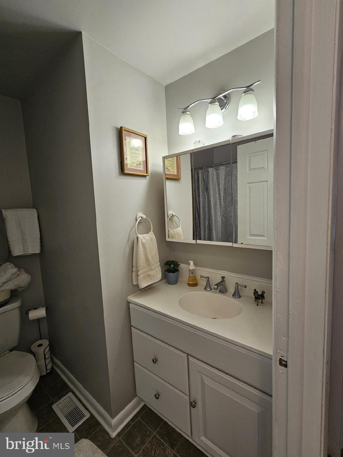 17607 Kohlhoss Road Poolesville, MD 20837 - Photo 29 of 29 a bathroom with a toilet sink and mirror