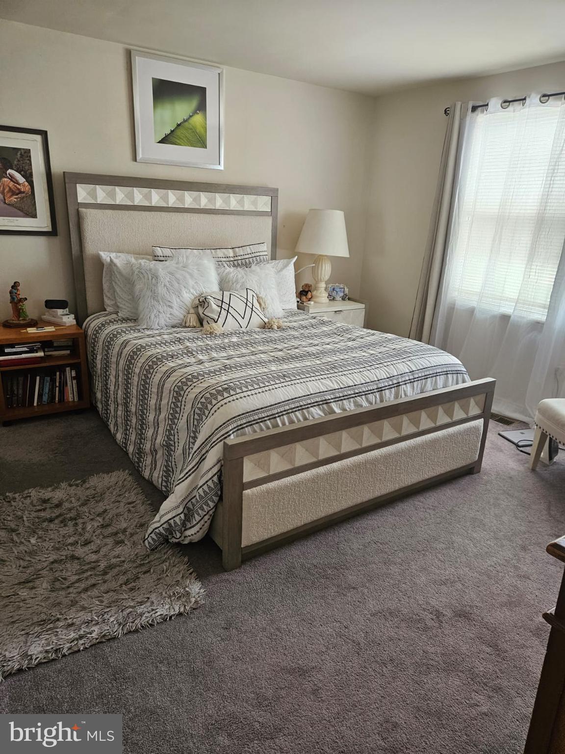 17607 Kohlhoss Road Poolesville, MD 20837 - Photo 3 of 29 a spacious bedroom with a bed and a window