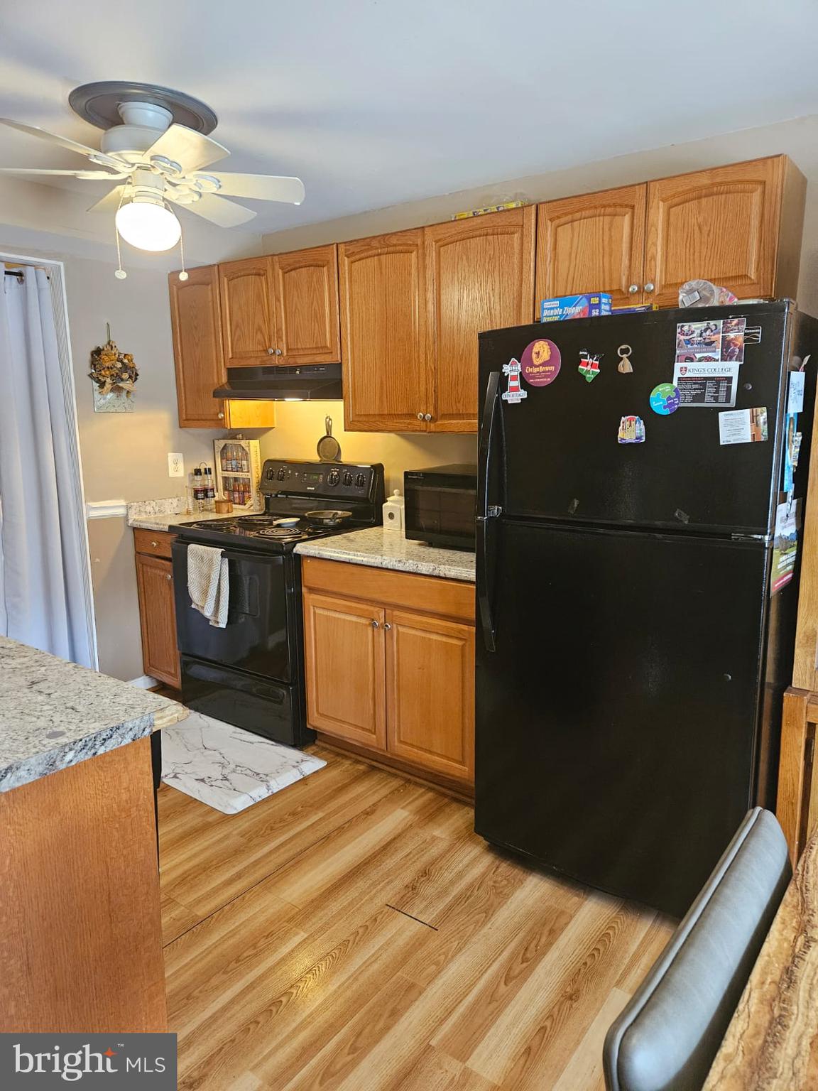 17607 Kohlhoss Road Poolesville, MD 20837 - Photo 10 of 29 a kitchen with stainless steel appliances granite countertop a refrigerator a sink a stove and island