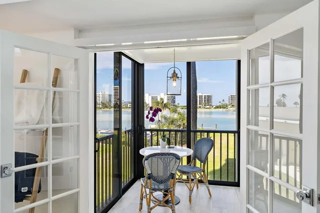 a view of room with painting on the wall and a desk