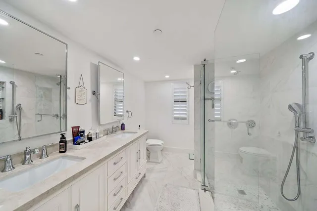 a bathroom with a shower and a sink
