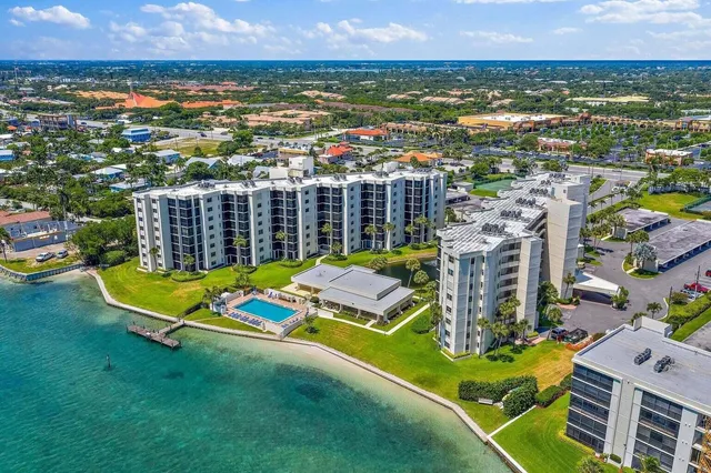 an aerial view of residential houses with outdoor space and garden