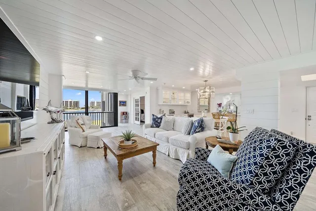 a living room with furniture rug and wooden floor