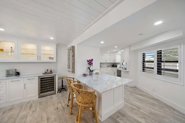 a kitchen with a table and chairs in it
