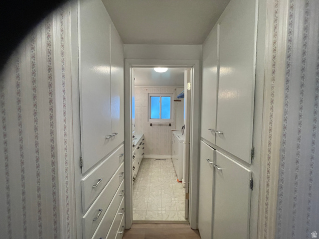 438 East Main Street Elsinore, UT 84724 - Photo 34 of 43 Hallway entry to half bath and laundry with extensive built-in cabinetry and drawers