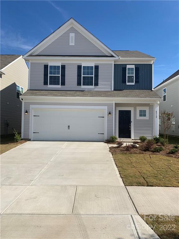 6512 Gopher Road, Unit 320 Lancaster, SC 29720 - Photo 1 of 12 a front view of a house with a yard
