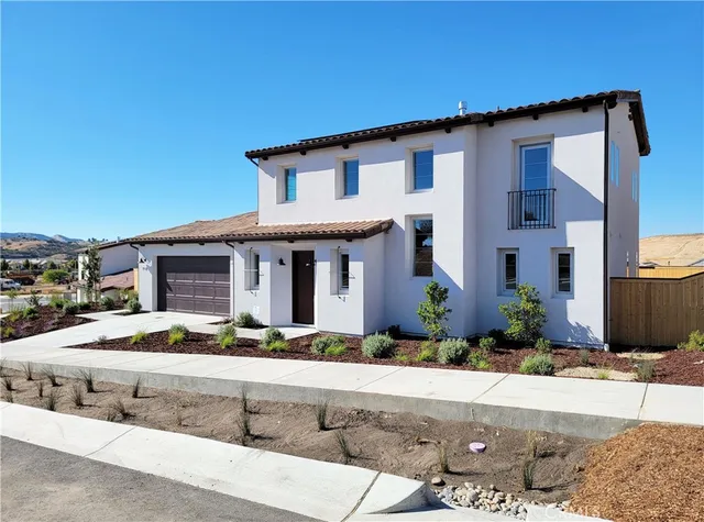 a front view of house with street