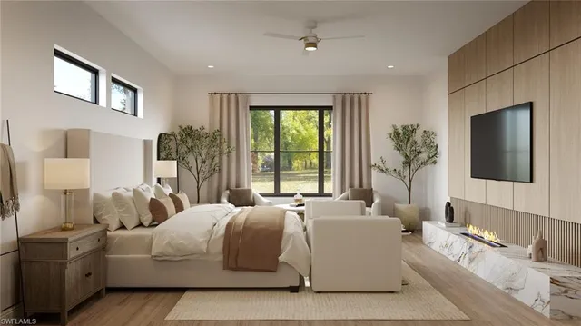 a bedroom with bed and a chandelier