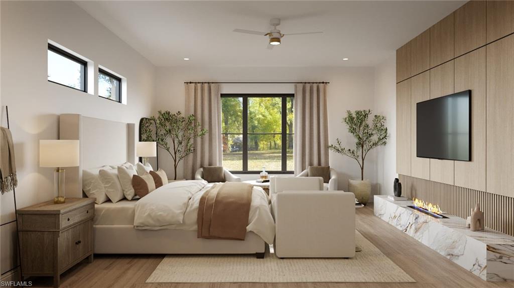 3898 Crayton Road Naples, FL 34103 - Photo 14 of 35 Photos are of a similar home by builder and are for illustrative purposes only. Bedroom featuring a ceiling fan, light wood-style flooring, and recessed lighting.