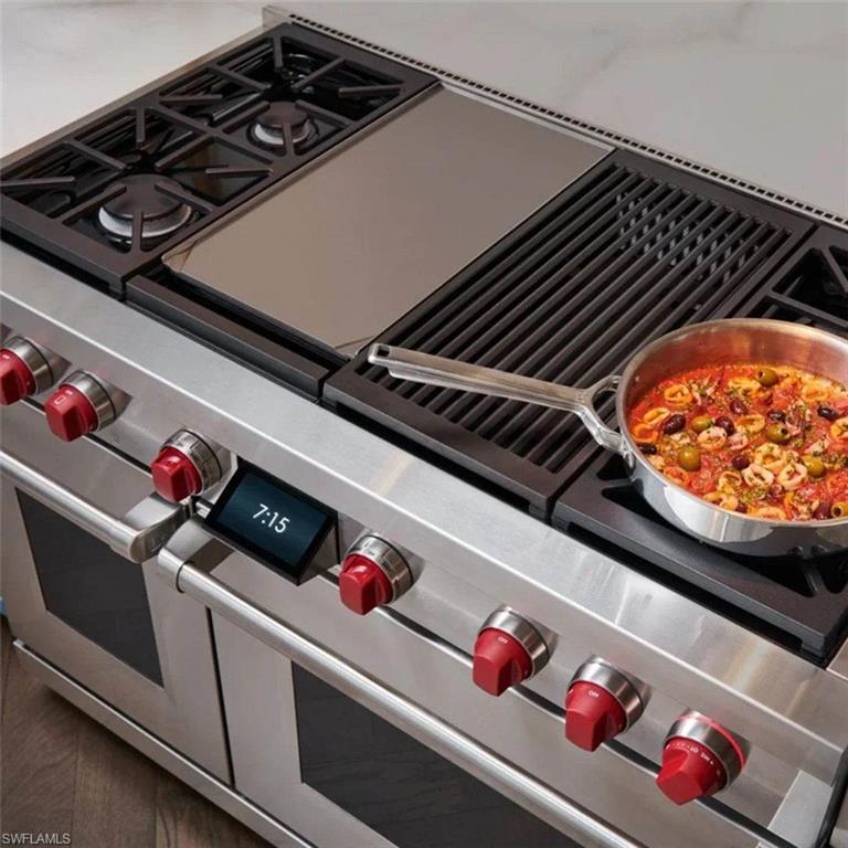 3898 Crayton Road Naples, FL 34103 - Photo 31 of 35 Kitchen view of range with two ovens, Wolf.