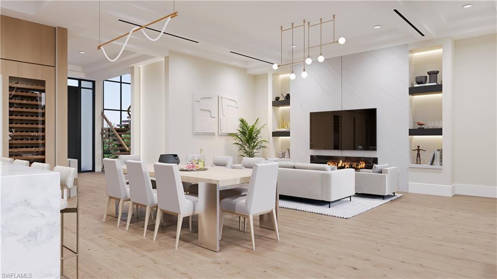 3898 Crayton Road Naples, FL 34103 - Photo 4 of 35 Architectural rendering. Plans and finishes can be customized. Dining area featuring light wood finished floors, beverage cooler, a fireplace, stairway, and recessed lighting.