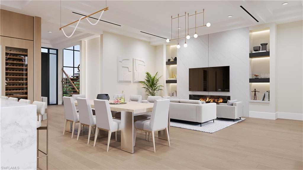 3898 Crayton Road Naples, FL 34103 - Photo 4 of 35 a view of a dining room with furniture window and wooden floor