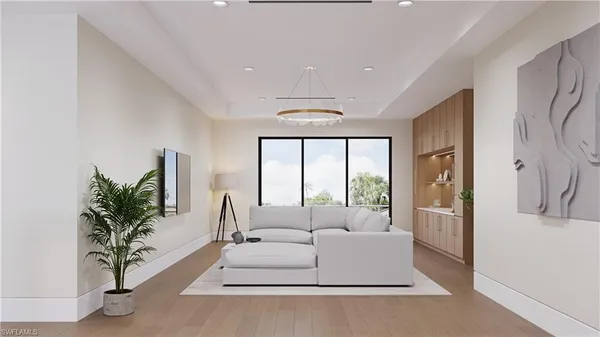 a living room with furniture and large windows
