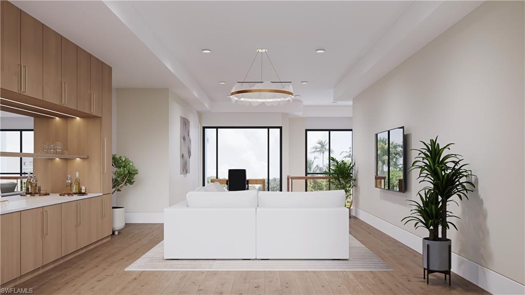 3898 Crayton Road Naples, FL 34103 - Photo 9 of 35 Architectural rendering. Plans and finishes can be customized. Upstairs living area with a tray ceiling, light wood finished floors, recessed lighting, and a desk.