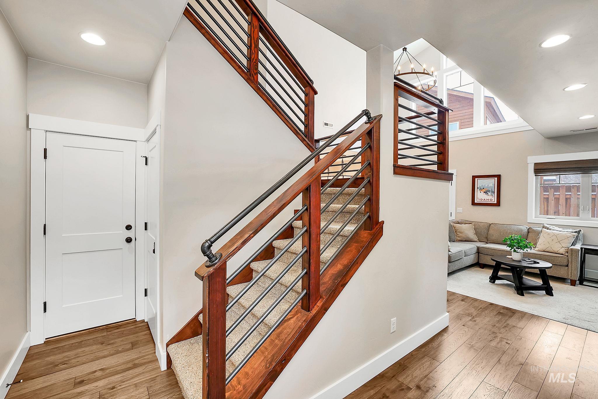 609 Blue Water Circle McCall, ID 83638 - Photo 6 of 45 Stairway with wood-type flooring and suspended lighting