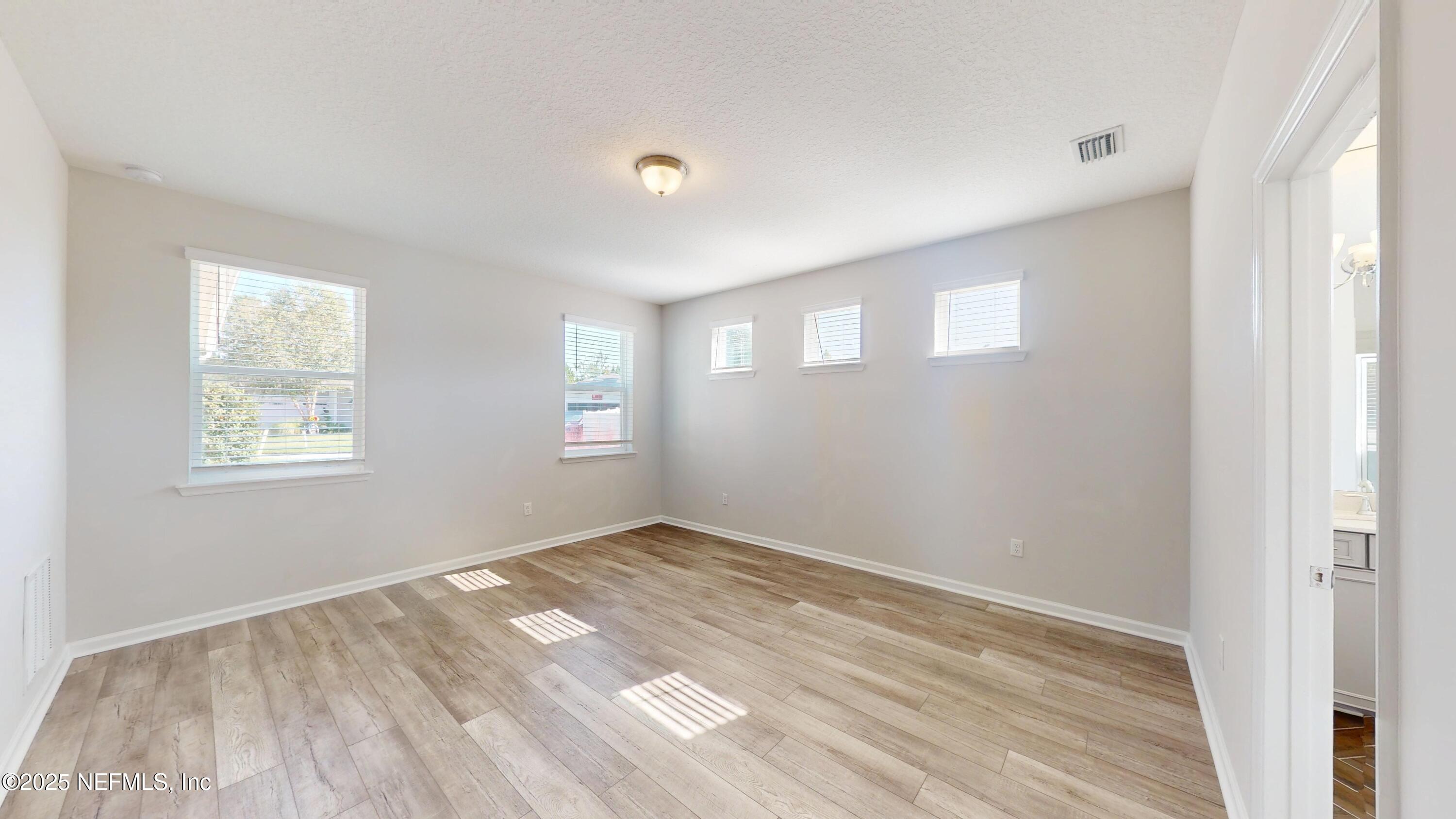 44 Footbridge Road St. Johns, FL 32259 - Photo 11 of 45 a view of empty room with wooden floor and fan