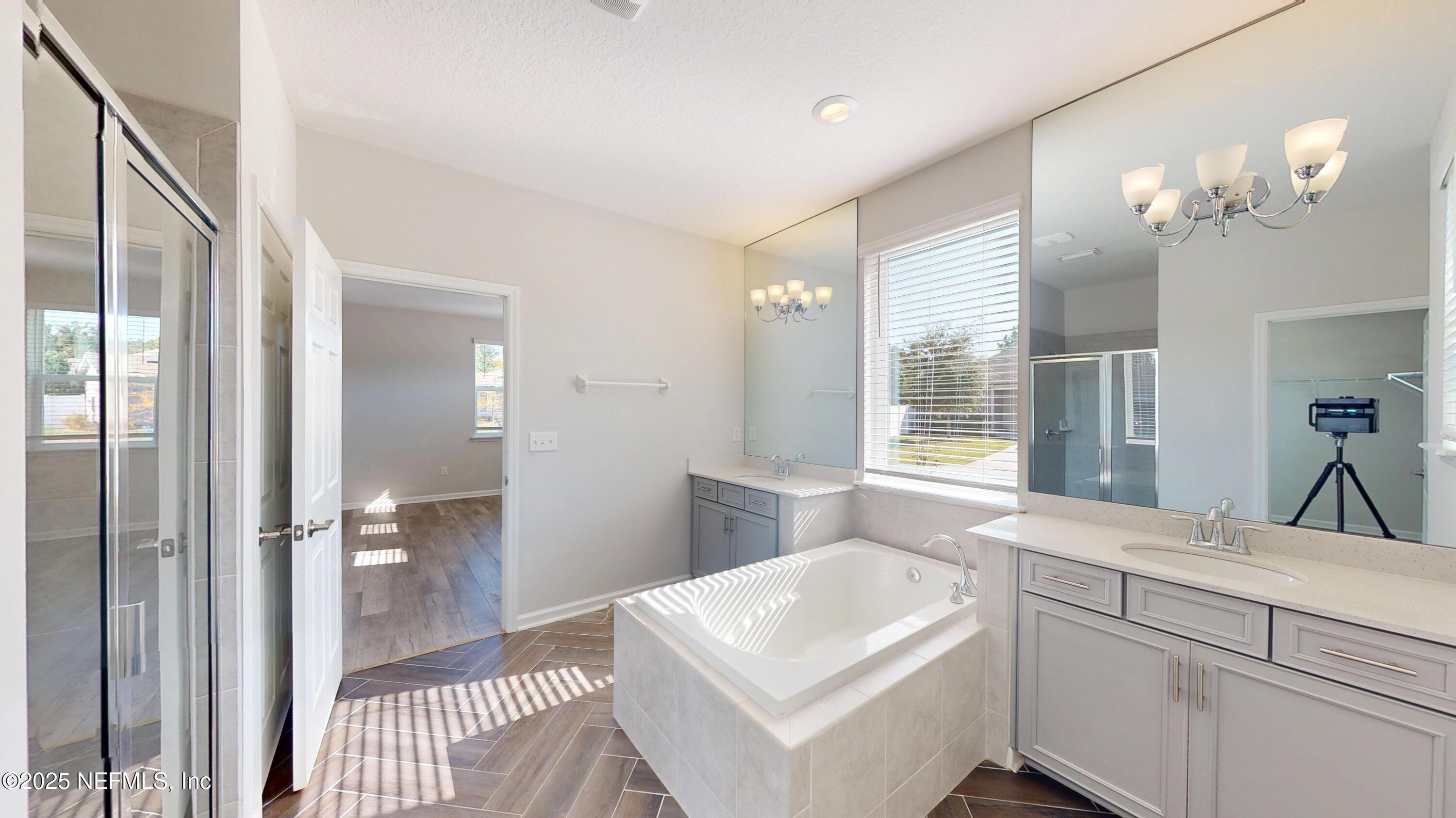 44 Footbridge Road St. Johns, FL 32259 - Photo 16 of 45 a en suite bathroom with a sink a large mirror and a shower