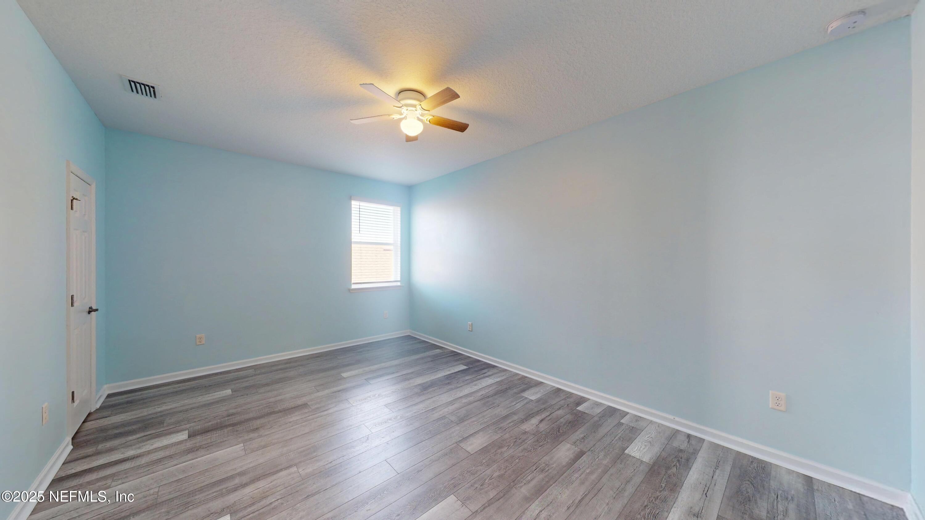 44 Footbridge Road St. Johns, FL 32259 - Photo 26 of 45 a view of an empty room with wooden floor and a window