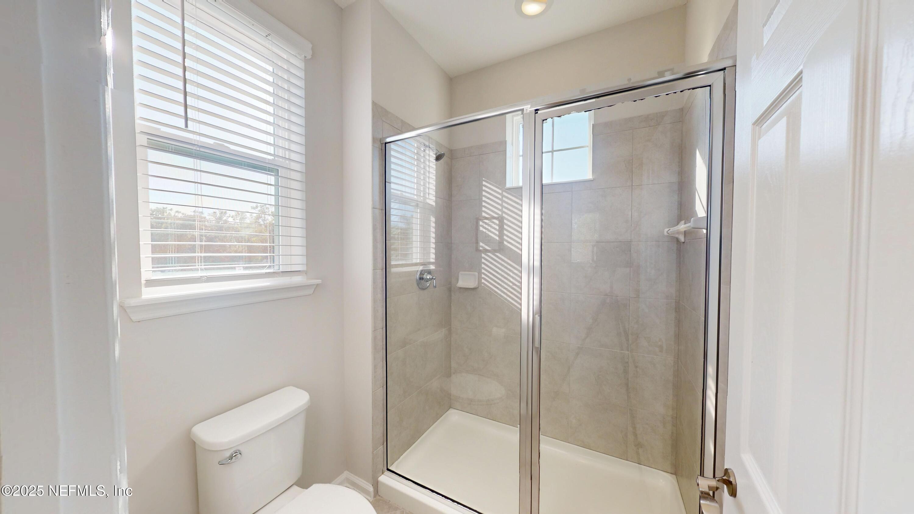 44 Footbridge Road St. Johns, FL 32259 - Photo 32 of 45 a bathroom with a shower and toilet