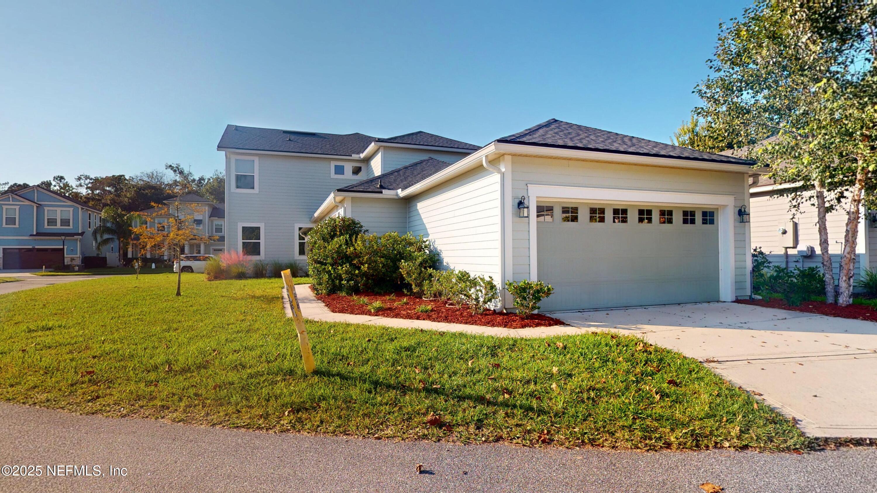 44 Footbridge Road St. Johns, FL 32259 - Photo 36 of 45 a front view of a house with a yard and garage