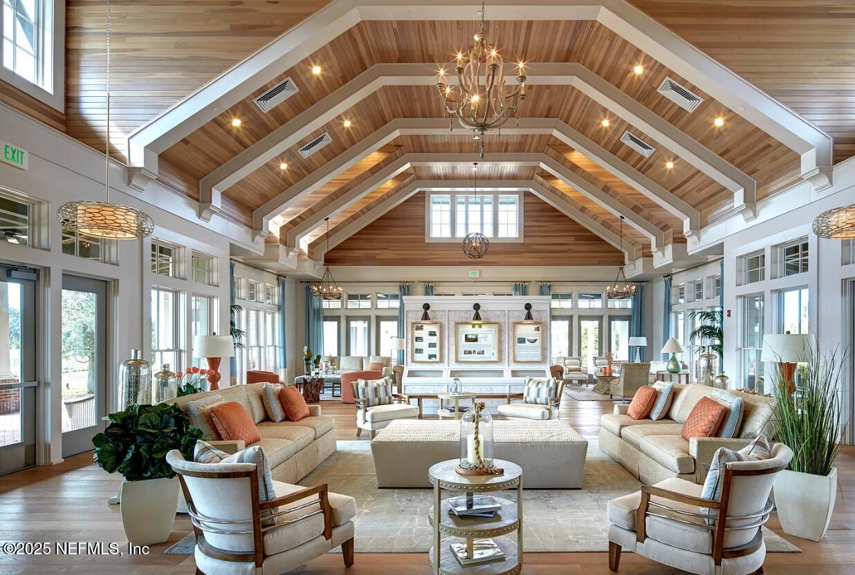 44 Footbridge Road St. Johns, FL 32259 - Photo 39 of 45 a living room with furniture and a chandelier