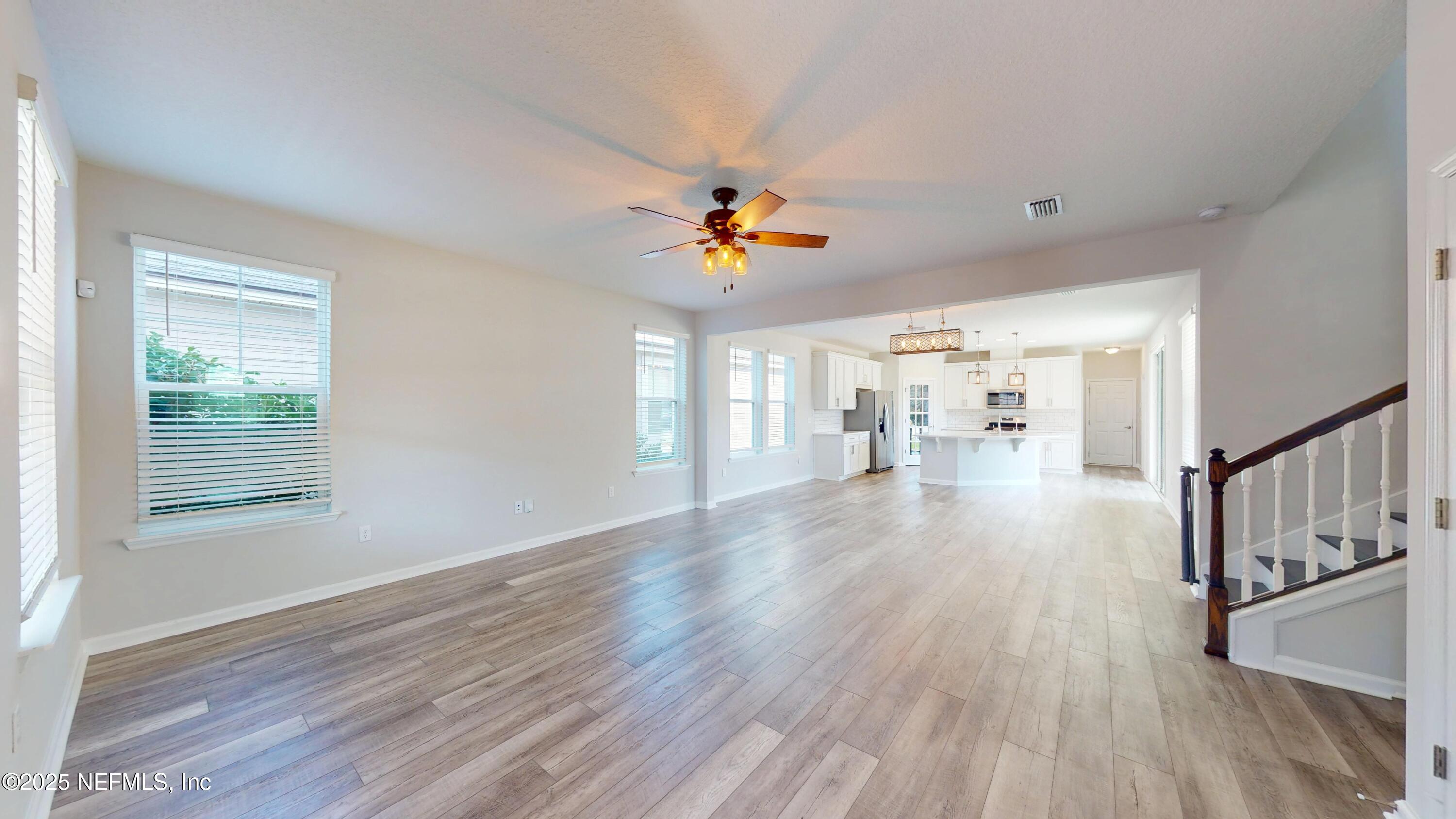 44 Footbridge Road St. Johns, FL 32259 - Photo 4 of 45 a view of an empty room with wooden floor and a window